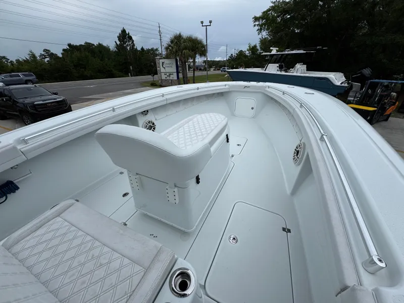 Slide: The Image of 2021 Yellowfin 36 Offshore boat interior with white seating and spacious deck. - 16