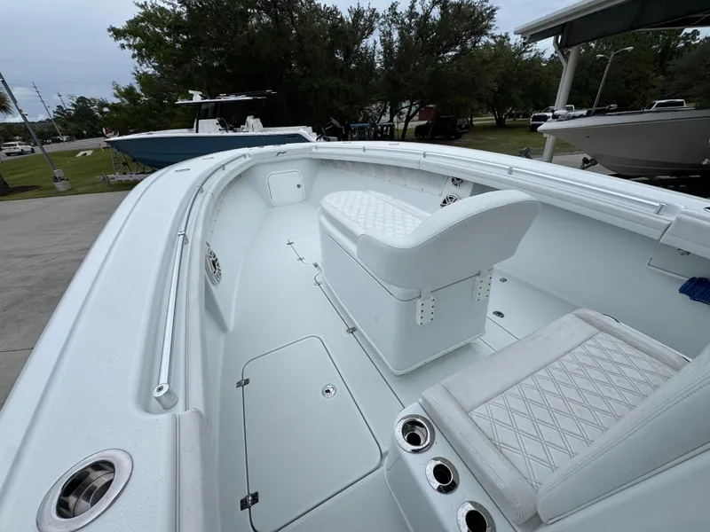 Slide: The Image of 2021 Yellowfin 36 Offshore boat interior with white seating and spacious deck. - 18