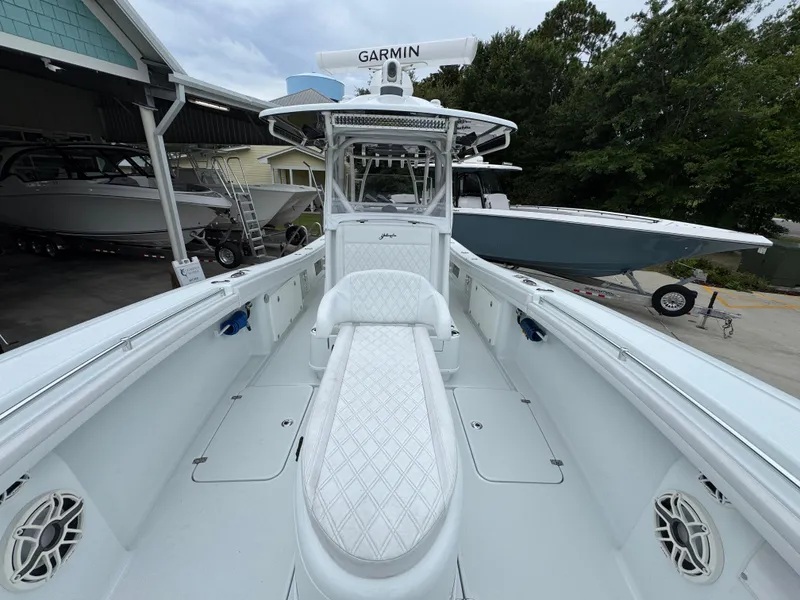 Slide: The Image of 2021 Yellowfin 36 Offshore boat with Garmin equipment, docked near other boats. - 21