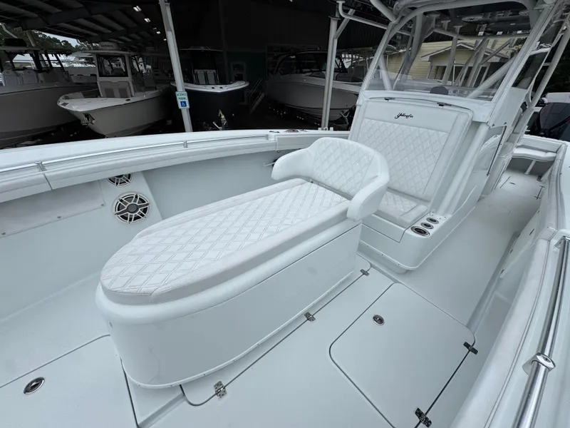 Slide: The Image of 2021 Yellowfin 36 Offshore boat interior with white seating and sleek design. - 22