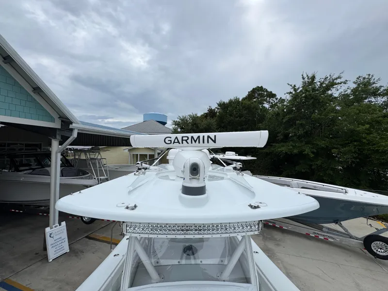 Slide: The Image of 2021 Yellowfin 36 Offshore boat with Garmin radar, docked under cloudy skies. - 23
