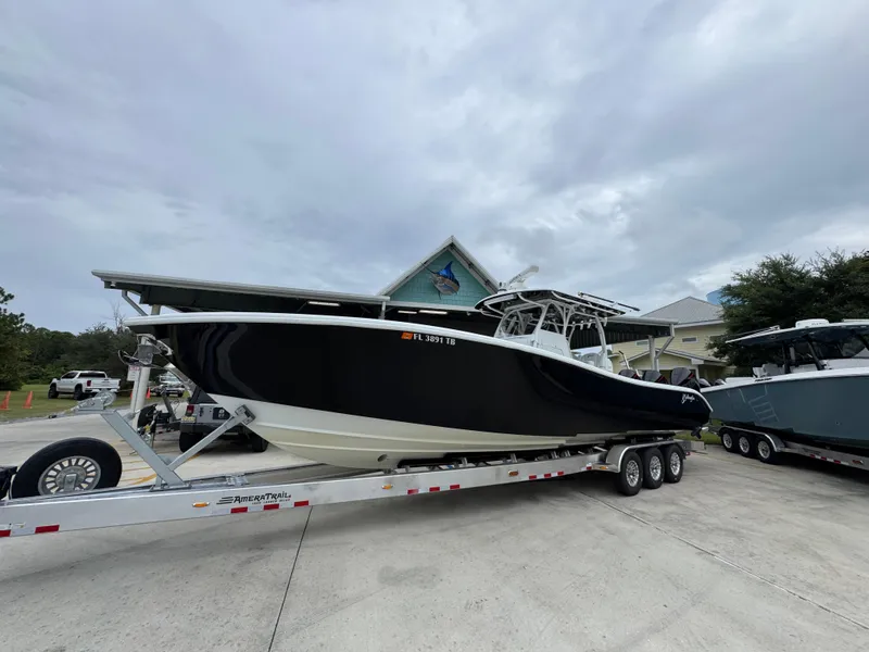Slide: The Image of 2021 Yellowfin 36 Offshore boat on trailer, parked outdoors. - 3