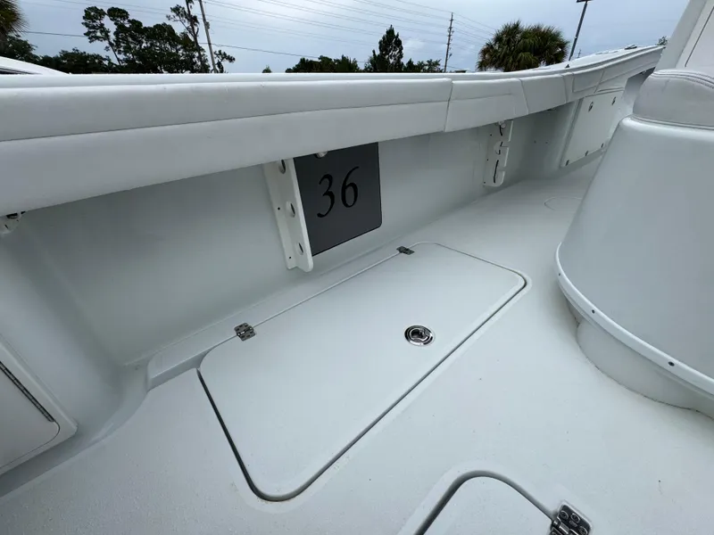 Slide: The Image of 2021 Yellowfin 36 Offshore boat interior with storage compartment and sleek design. - 33