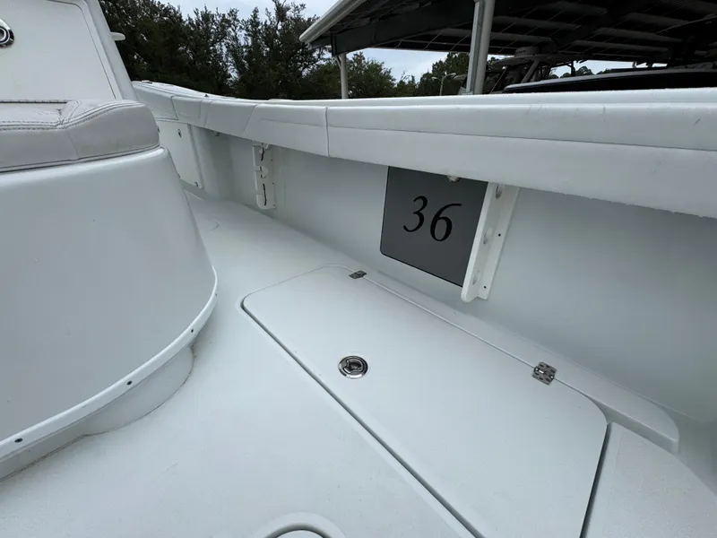 Slide: The Image of 2021 Yellowfin 36 Offshore boat interior with storage compartment and number 36 displayed. - 34