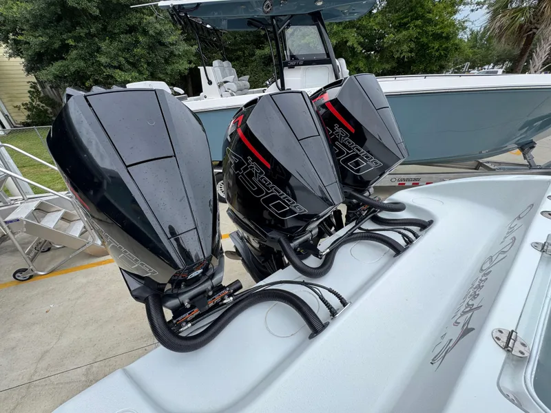 Slide: The Image of 2021 Yellowfin 36 Offshore boat with triple outboard engines, parked on a trailer. - 39
