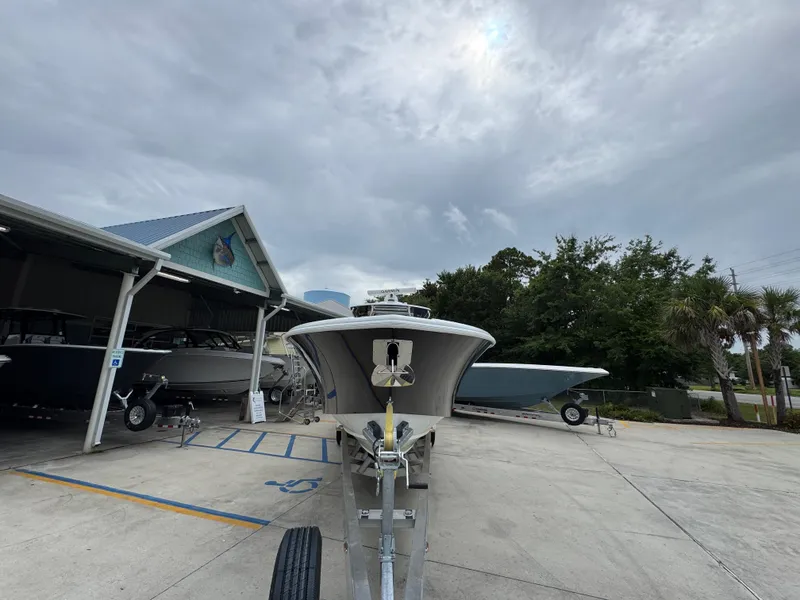 Slide: The Image of 2021 Yellowfin 36 Offshore boat on trailer at marina under cloudy sky. - 5