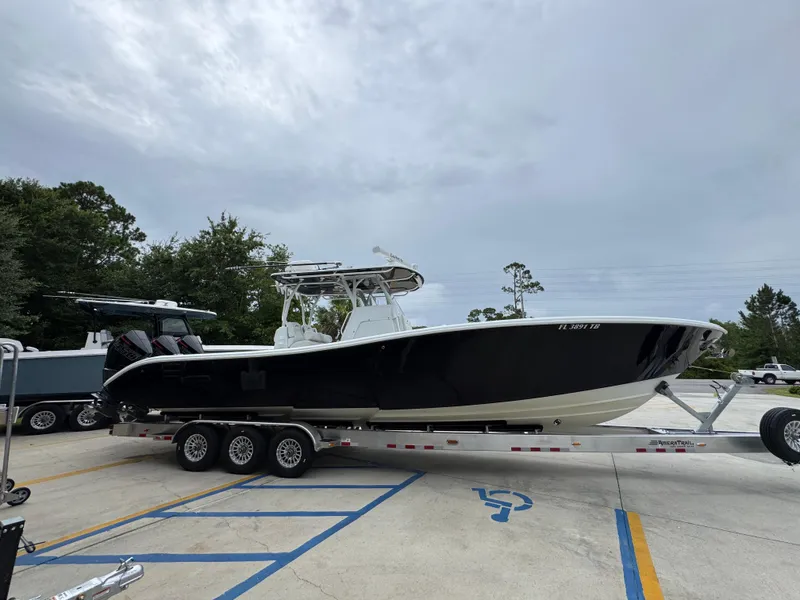 Slide: The Image of 2021 Yellowfin 36 Offshore boat on trailer in parking lot. - 9
