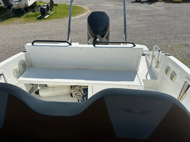 Slide: The Image of 2022 Beneteau Flyer 8 SUNdeck boat interior with storage and motor view. - 10