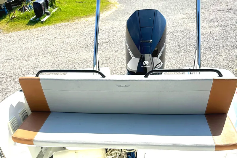 Slide: The Image of 2022 Beneteau Flyer 8 SUNdeck boat with cushioned seating and Mercury outboard motor. - 16