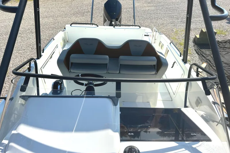 Slide: The Image of 2022 Beneteau Flyer 8 SUNdeck boat interior with steering wheel and seating area. - 17