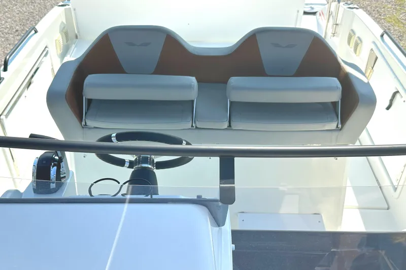 Slide: The Image of 2022 Beneteau Flyer 8 SUNdeck cockpit with steering wheel and seating area. - 18