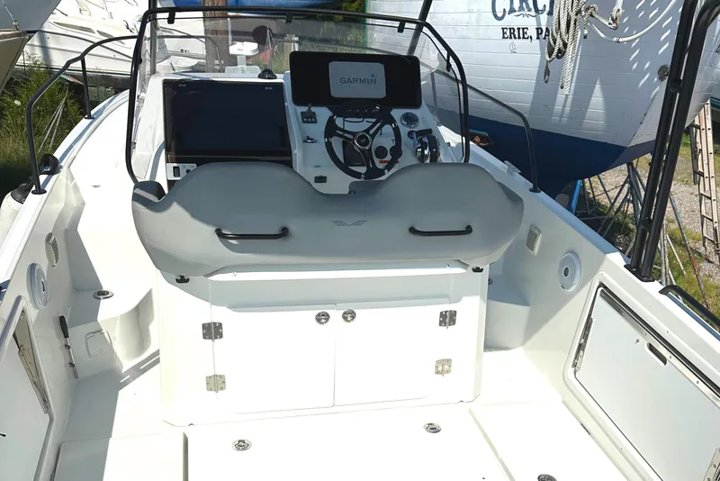 Slide: The Image of 2022 Beneteau Flyer 8 SUNdeck cockpit with Garmin navigation system and modern controls. - 22