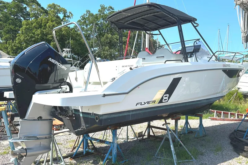 Slide: The Image of 2022 Beneteau Flyer 8 SUNdeck boat with Mercury engine on stands, outdoors. - 23