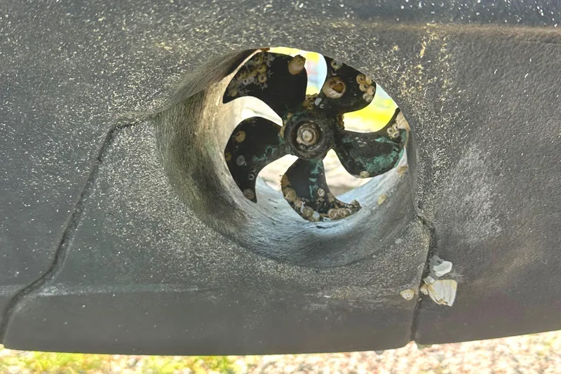 Slide: The Image of Close-up of a 2022 Beneteau Flyer 8 SUNdeck propeller with marine growth. - 24