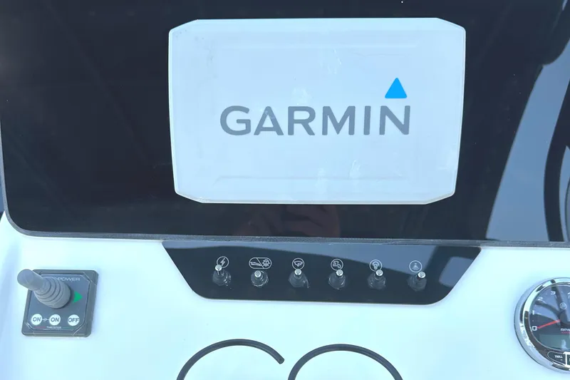 Slide: The Image of Garmin display on 2022 Beneteau Flyer 8 SUNdeck boat dashboard with control switches. - 27