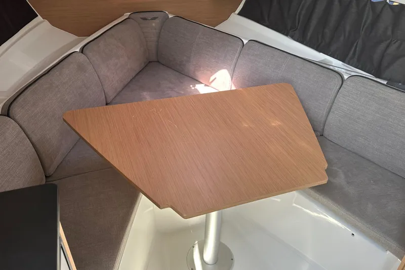 Slide: The Image of Interior of 2022 Beneteau Flyer 8 SUNdeck with cozy seating and wooden table. - 28