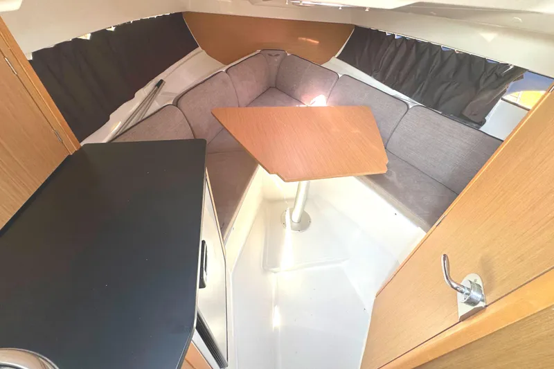 Slide: The Image of 2022 Beneteau Flyer 8 SUNdeck interior with cozy seating and wooden table. - 31