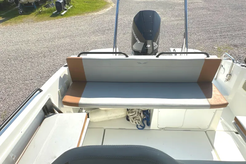 Slide: The Image of 2022 Beneteau Flyer 8 SUNdeck boat interior with seating and Mercury engine. - 36