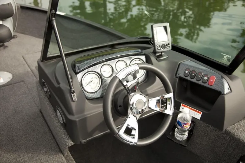 Slide: The Image of Manufacturer Provided Image: 2016 Lowe FM 165 Pro WT boat dashboard with steering wheel and gauges. - 9