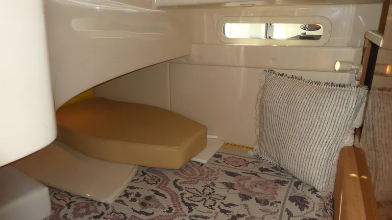 Slide: The Image of Interior cabin of 2002 Maxum 3100 SCR boat with cozy seating and window. - 29