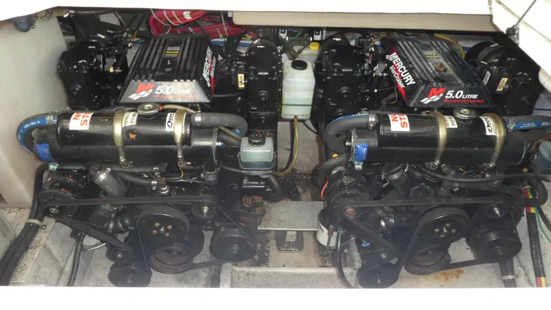 Slide: The Image of Twin Mercury 5.0L engines in a 2002 Maxum 3100 SCR boat. - 34