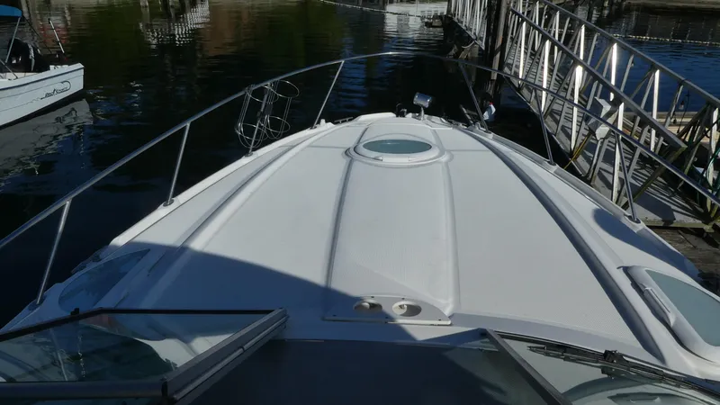 Slide: The Image of 2002 Maxum 3100 SCR boat docked at marina, view from bow. - 38