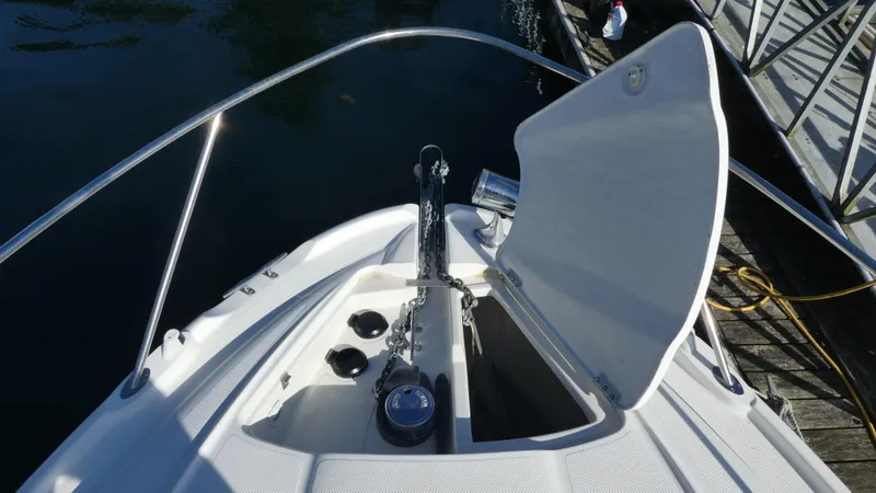 Slide: The Image of Bow of 2002 Maxum 3100 SCR boat with open anchor locker. - 39