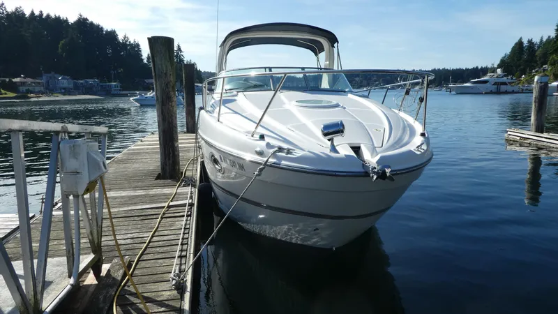 Slide: The Image of 2002 Maxum 3100 SCR boat docked at a serene marina. - 40