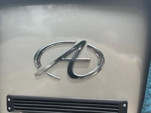 Slide: The Image of Avalon Catalina Quad Lounger 2021 logo on a sleek metallic surface. - 14