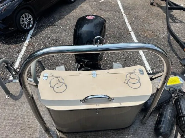 Slide: The Image of 2021 Avalon Catalina Quad Lounger boat with motor, parked on gravel. - 18