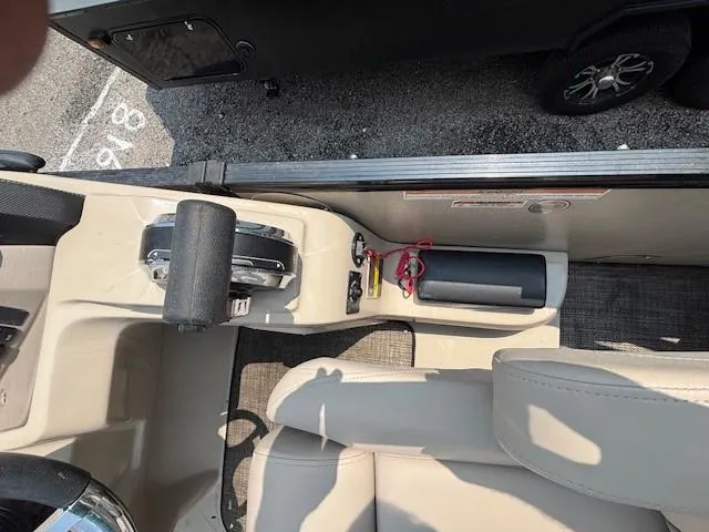 Slide: The Image of Interior view of 2021 Avalon Catalina Quad Lounger boat, featuring control panel and seating. - 23