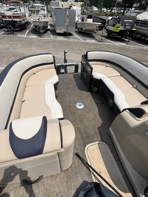 Slide: The Image of 2021 Avalon Catalina Quad Lounger boat interior with beige seating and spacious layout. - 24