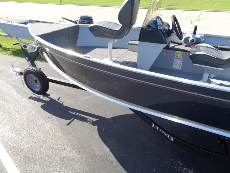 Slide: The Image of 2025 Lund 1600 Fury SS boat on trailer, featuring sleek design and comfortable seating. - 4