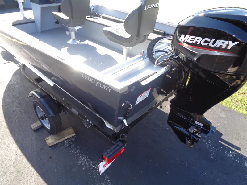 Slide: The Image of 2025 Lund 1600 Fury SS boat with Mercury outboard motor on trailer. - 5