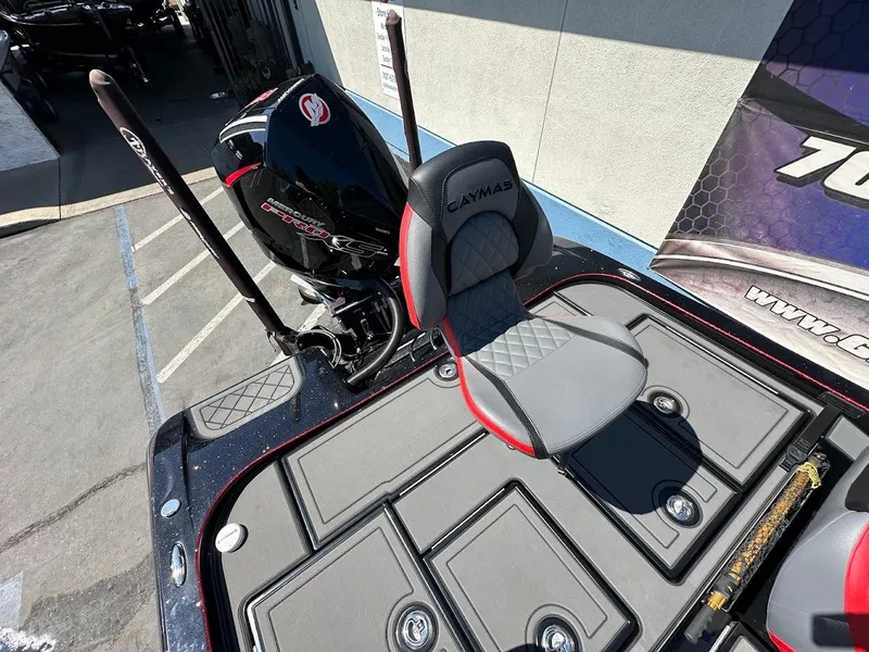 Slide: The Image of 2024 Caymas XS 20 Pro boat with sleek seating and powerful engine. - 12