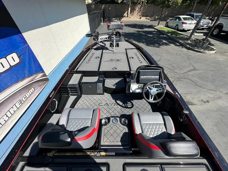 Slide: The Image of 2024 Caymas XS 20 Pro boat interior with steering wheel and seating. - 13