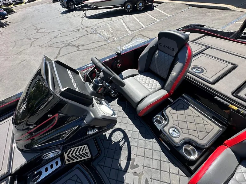Slide: The Image of 2024 Caymas XS 20 Pro boat interior with modern seating and control panel. - 18