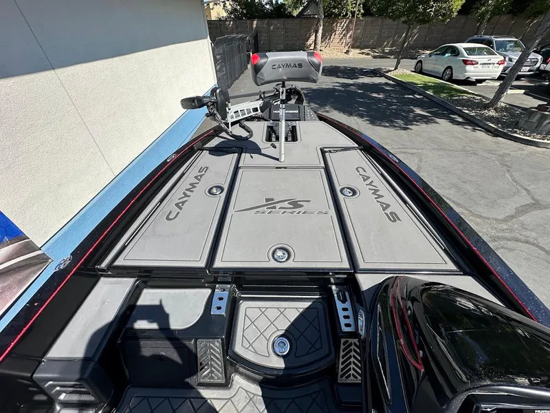 Slide: The Image of 2024 Caymas XS 20 Pro boat deck with storage compartments and seating. - 22