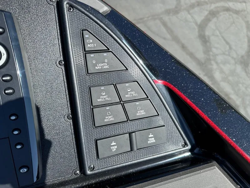 Slide: The Image of Control panel of 2024 Caymas XS 20 Pro boat with various function buttons. - 28
