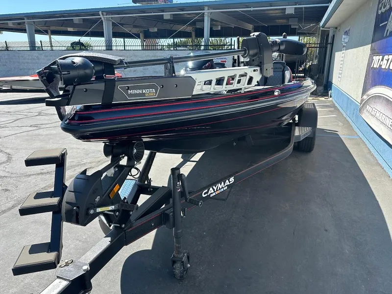 Slide: The Image of 2024 Caymas XS 20 Pro boat on trailer with Minn Kota Ultrex motor. - 3