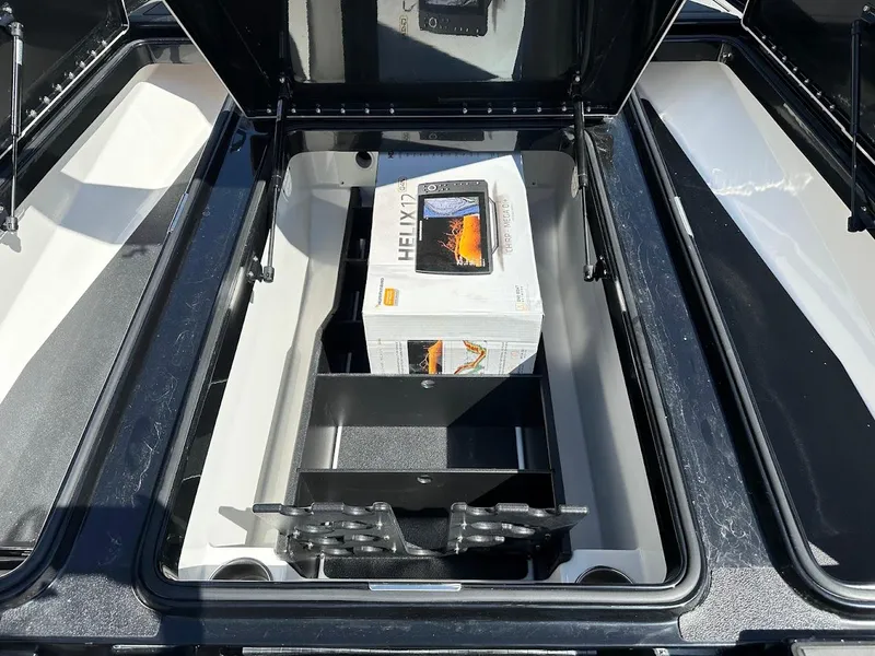 Slide: The Image of 2024 Caymas XS 20 Pro storage compartment with electronics box inside. - 30