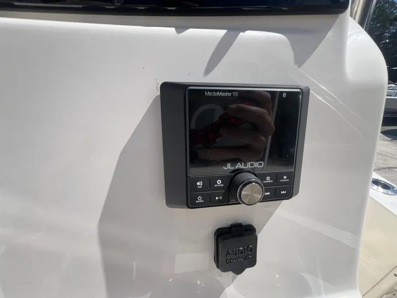Slide: The Image of JL Audio MediaMaster 55 on 2026 Pioneer 180 Islander boat dashboard. - 14