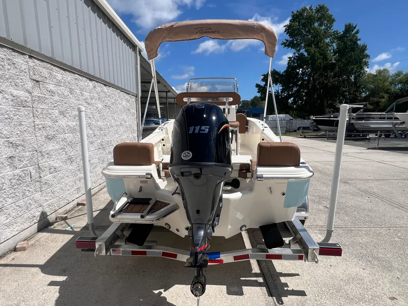 Slide: The Image of 2026 Pioneer 180 Islander boat with 115 HP engine on trailer, outdoor setting. - 5
