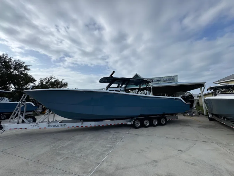 The Image of 2026 Invincible 46 Catamaran on trailer under cloudy sky. - 1