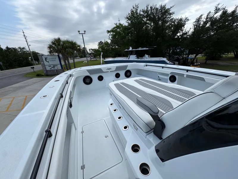 Slide: The Image of 2026 Invincible 46 Catamaran with spacious seating and modern design, docked at Grande Marine. - 18