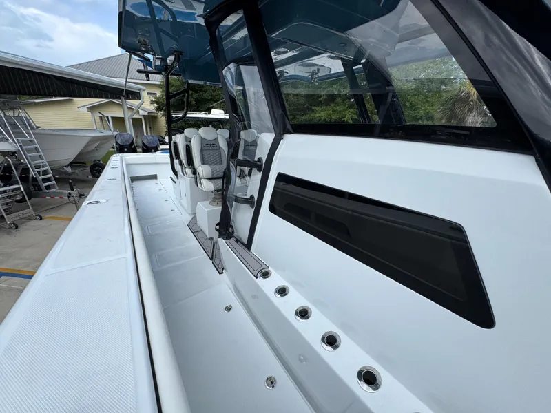 Slide: The Image of 2026 Invincible 46 Catamaran with sleek design and modern seating. - 23