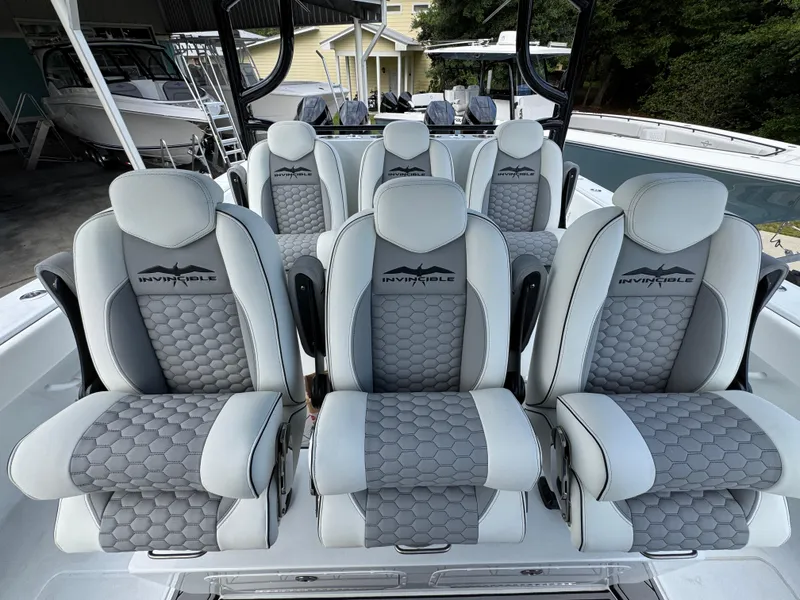 Slide: The Image of Luxury seating on 2026 Invincible 46 Catamaran, featuring stylish gray upholstery and ergonomic design. - 28
