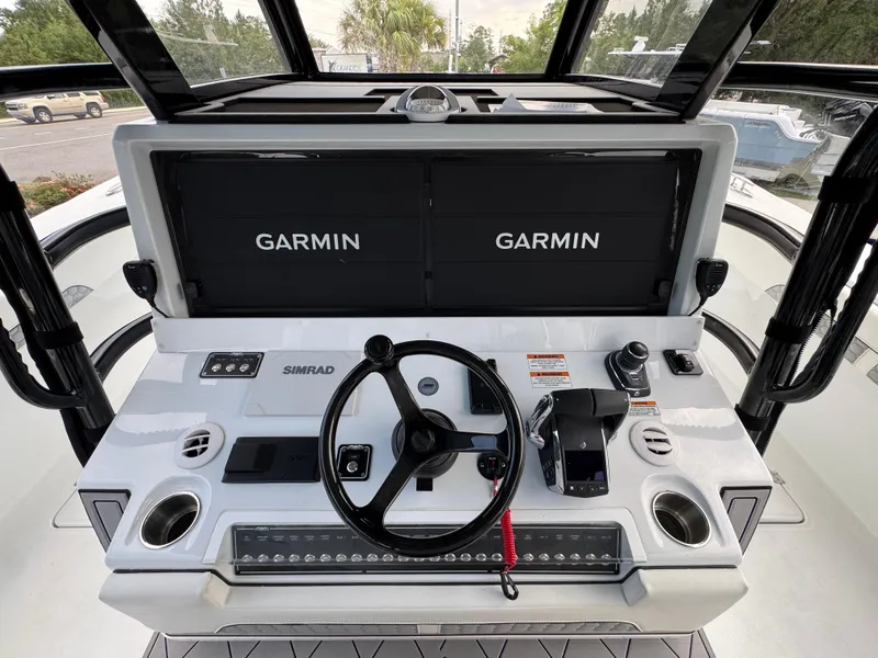 Slide: The Image of Helm of 2026 Invincible 46 Catamaran with Garmin displays and Simrad controls. - 30
