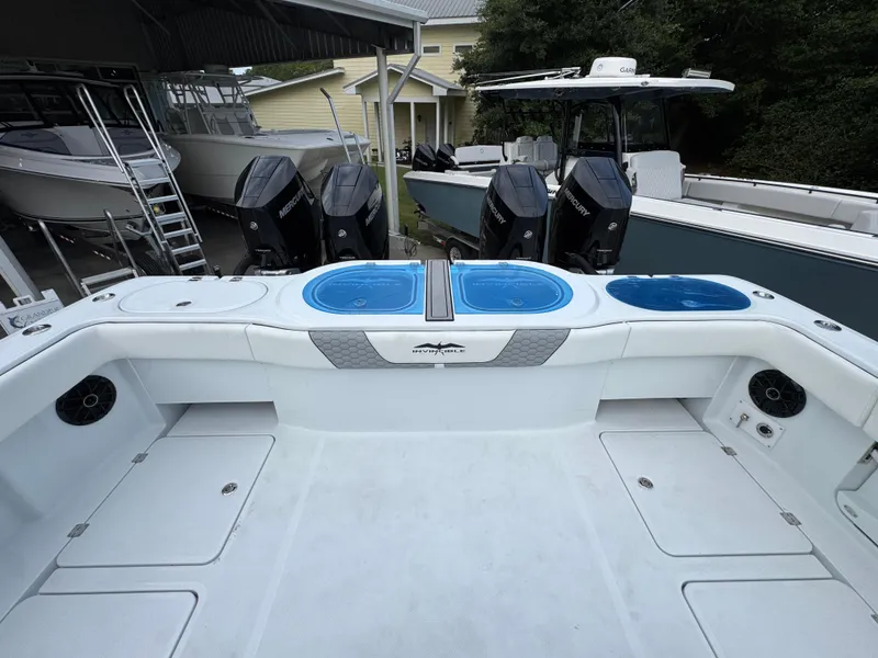 Slide: The Image of 2026 Invincible 46 Catamaran with multiple outboard engines and spacious deck area. - 38