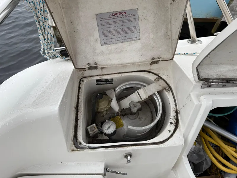 Slide: The Image of Open propane storage compartment on a 2000 Catalina 36 MkII sailboat. - 16